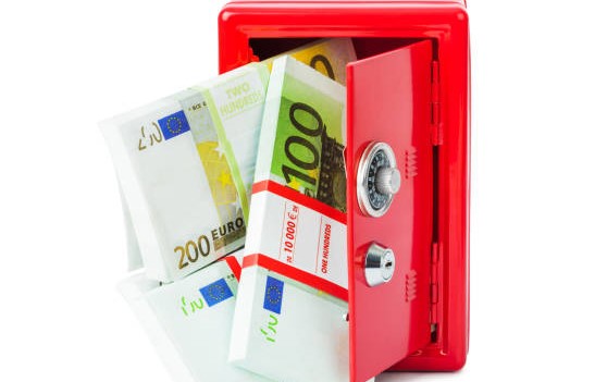 safe with money isolated on white background